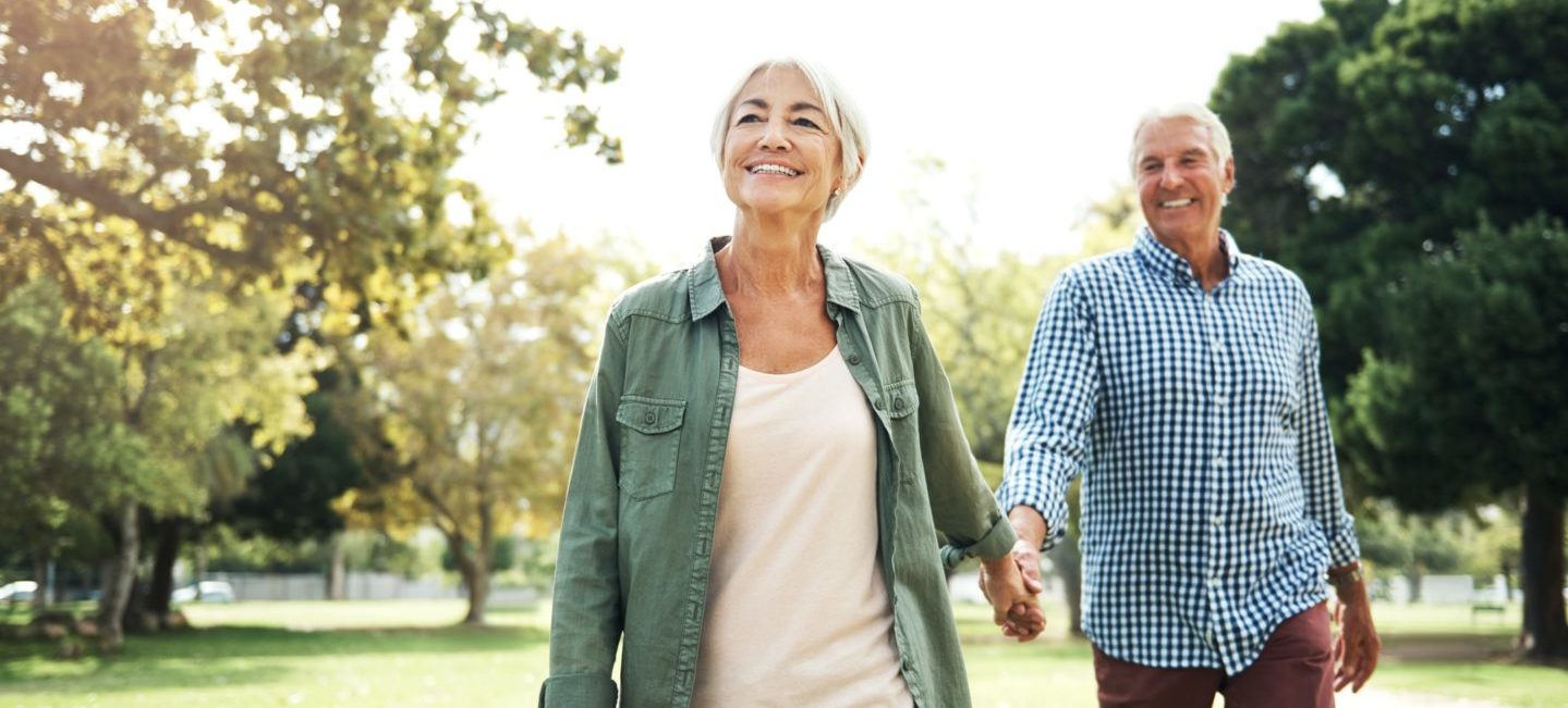 Shot of a happy senior couple going for a walk in the park